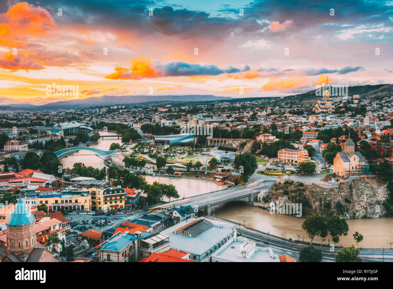 Evening View Of Tbilisi At Colorful Sunset. Georgia. Summer Cityscape. Stock Photo