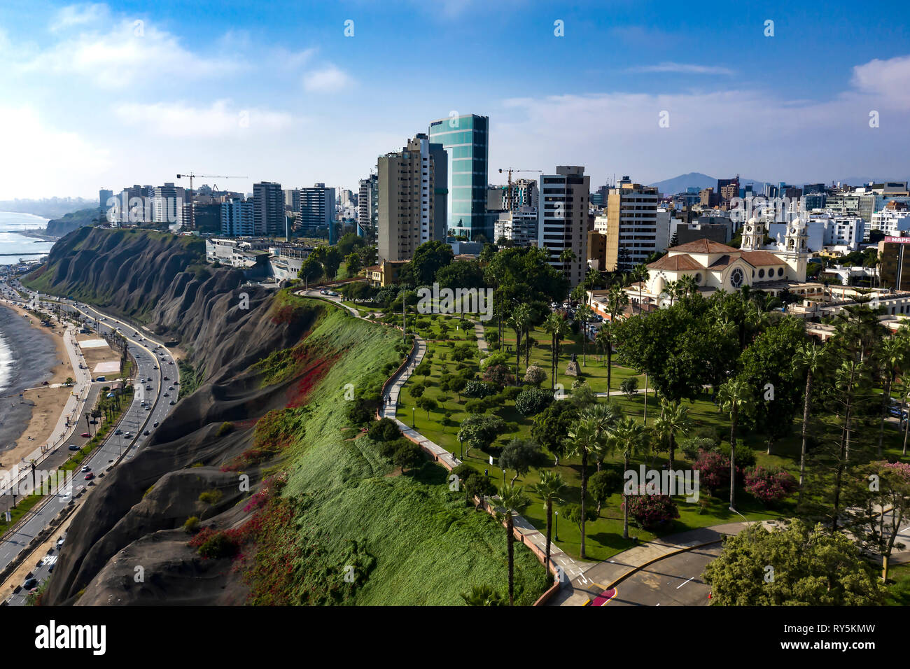 Lima, Peru - March 11 2019: Aerial view of Miraflores shoreline including Domodossola park and Larcomar shopping mall. Clear and bright day, travel an Stock Photo