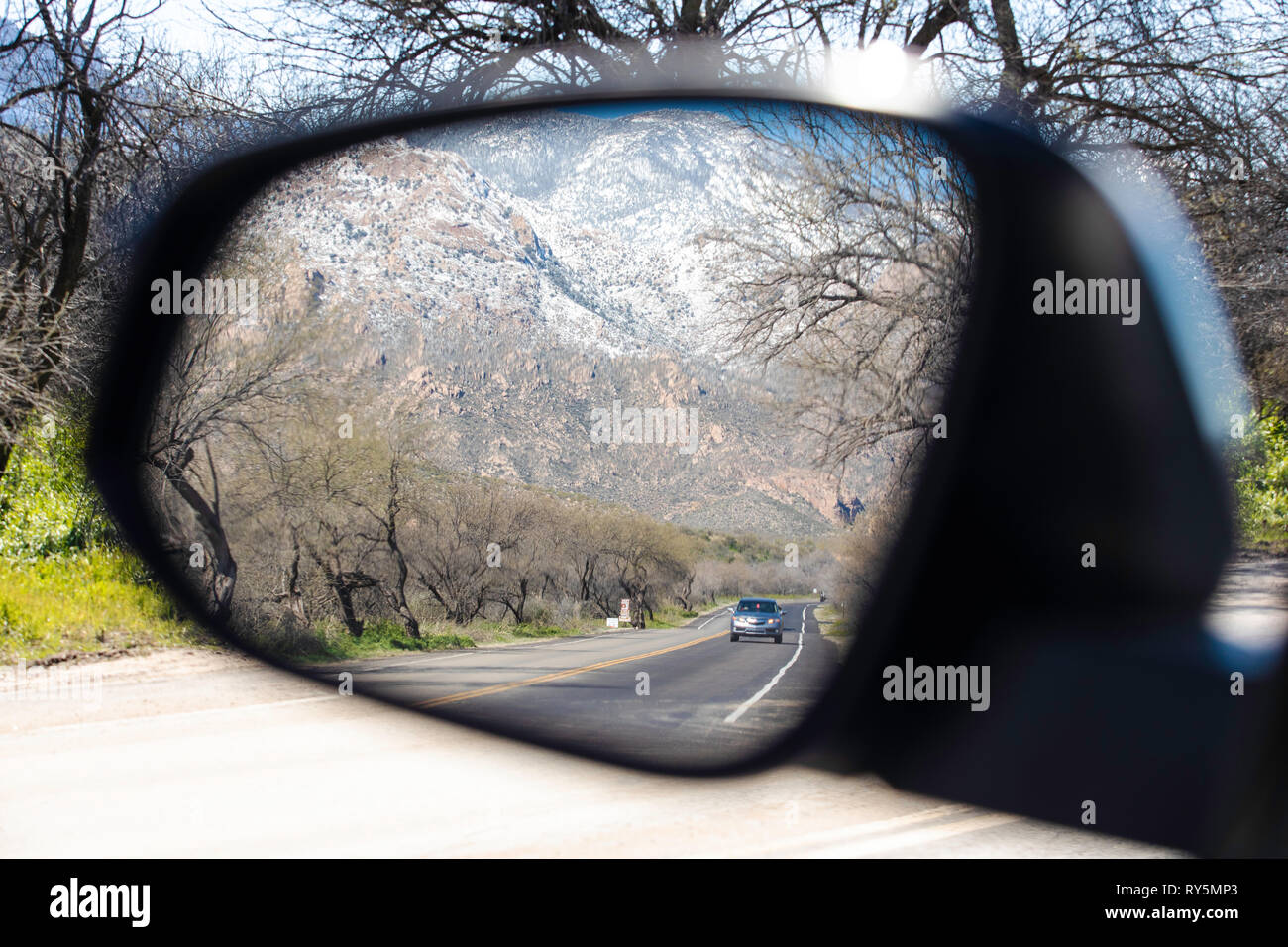 Scenic reflections in a side view mirror from inside a car. Catalina State Park, Tucson, Arizona Stock Photo