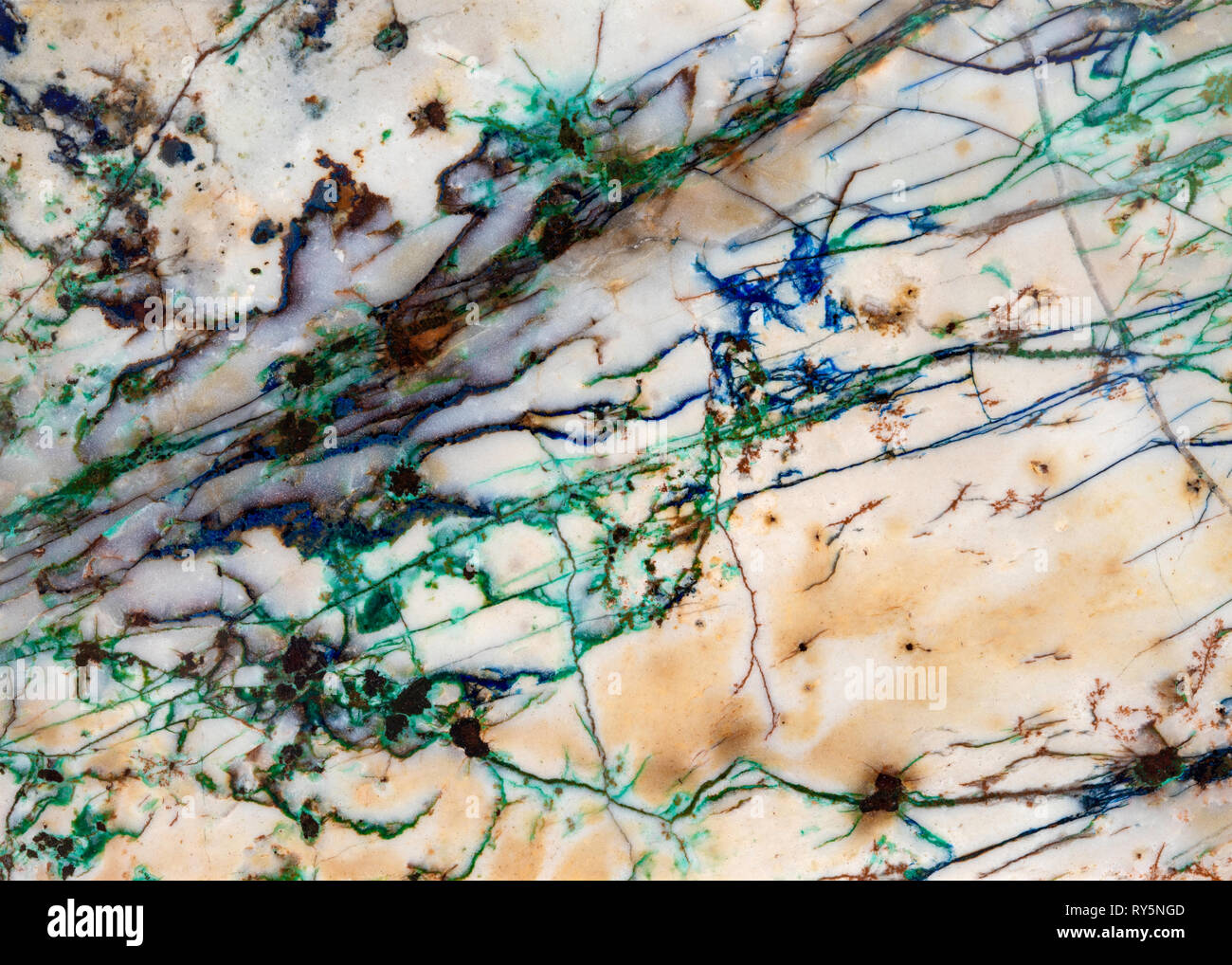 Detail of mineral veins running thru a slice of rock. The blue and green are Azurite and Malachite respectively. Stock Photo