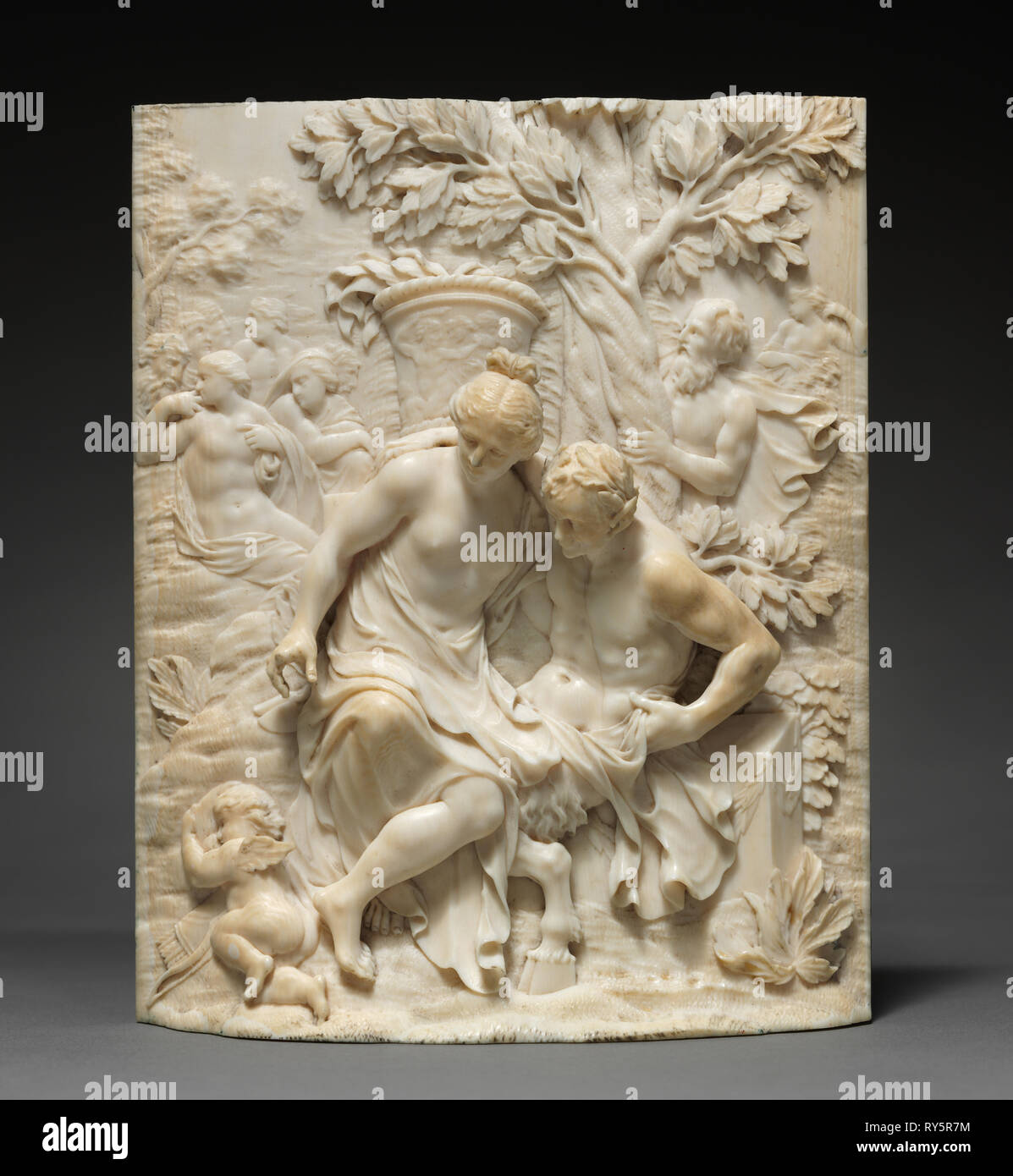 Venus and a Satyr , c. 1700. Ignaz Elhafen (German, 1658-1715). Ivory; overall: 15.5 x 12.4 x 3 cm (6 1/8 x 4 7/8 x 1 3/16 in Stock Photo