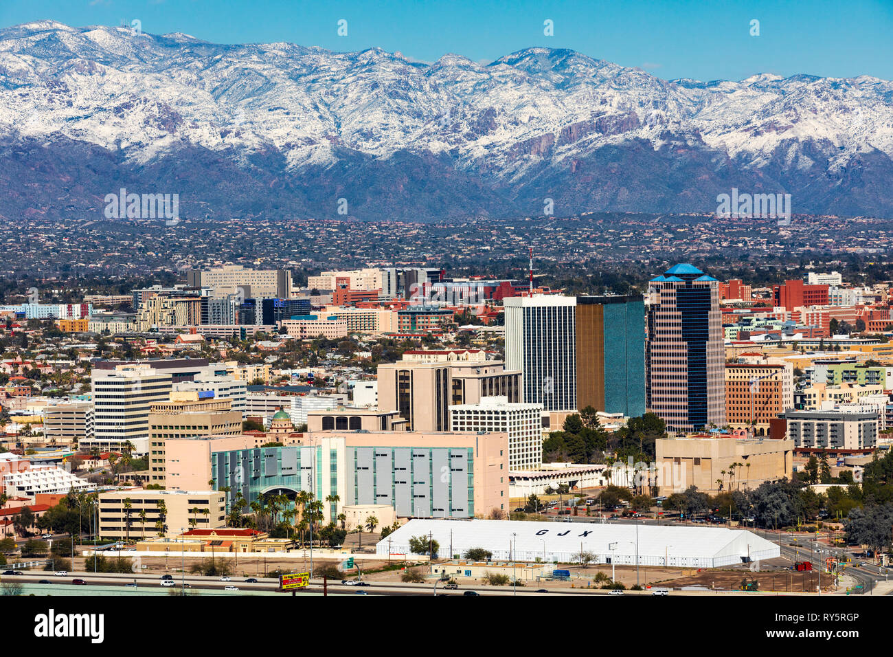 View of downtown Tucson, Arizona in winter, snow on the Santa Catalina Mountains in the distance. Stock Photo