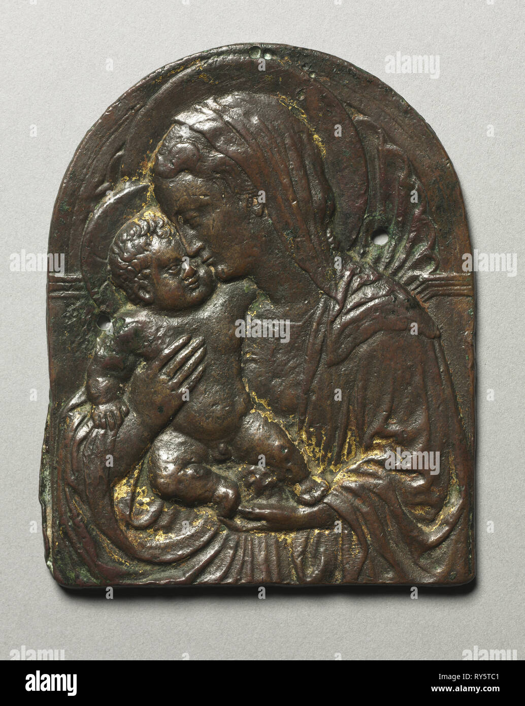 Virgin and Child, c. 1440. Circle of Donatello (Italian, c. 1386-1466). Bronze with traces of gilding; overall: 9.5 x 7.6 cm (3 3/4 x 3 in Stock Photo