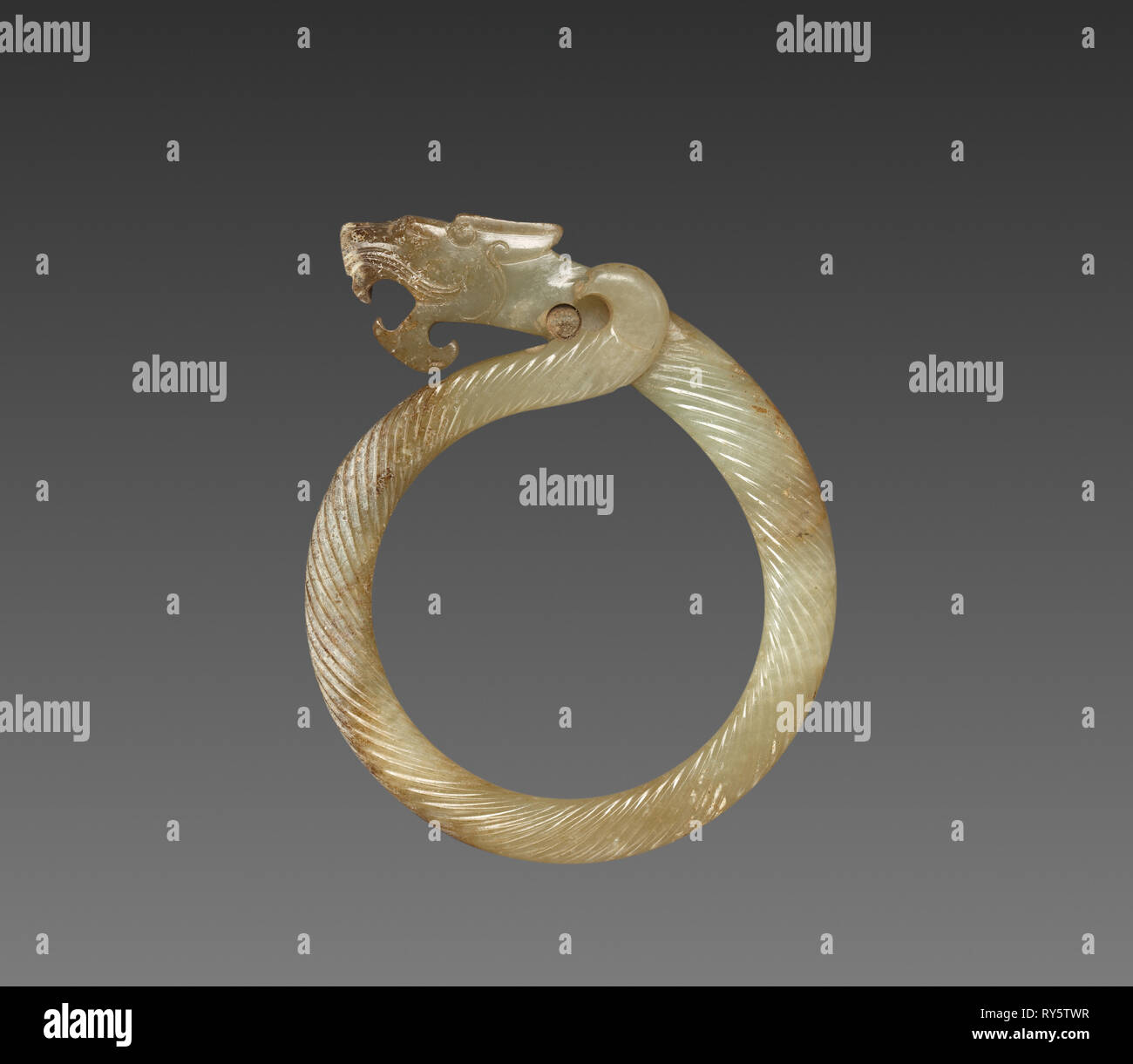 Fluted Ring with Dragon Head (Huan), 475-221 BC. China, Warring States period (475-221 BC). Jade (nephrite); overall: 9.1 cm (3 9/16 in Stock Photo