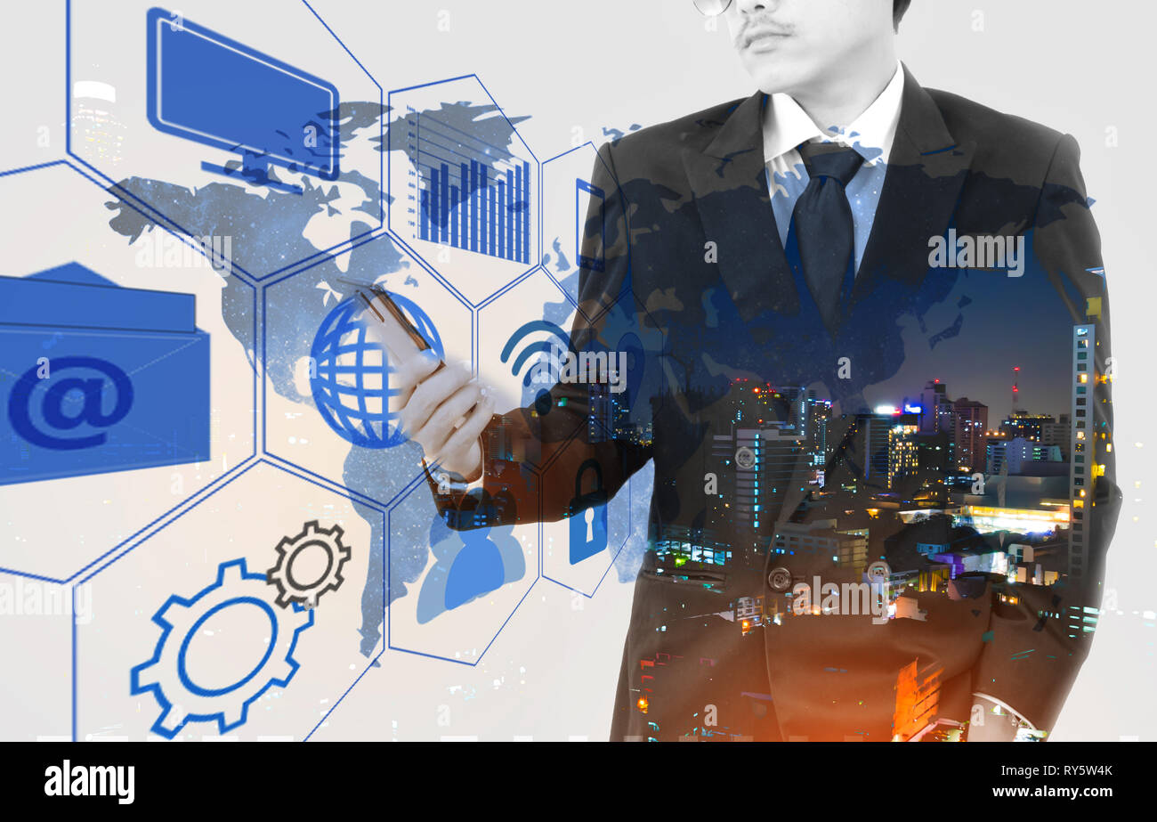 Double exposure of a businessman and a city using smartphone. Flip effect people. Technology effect. Stock Photo