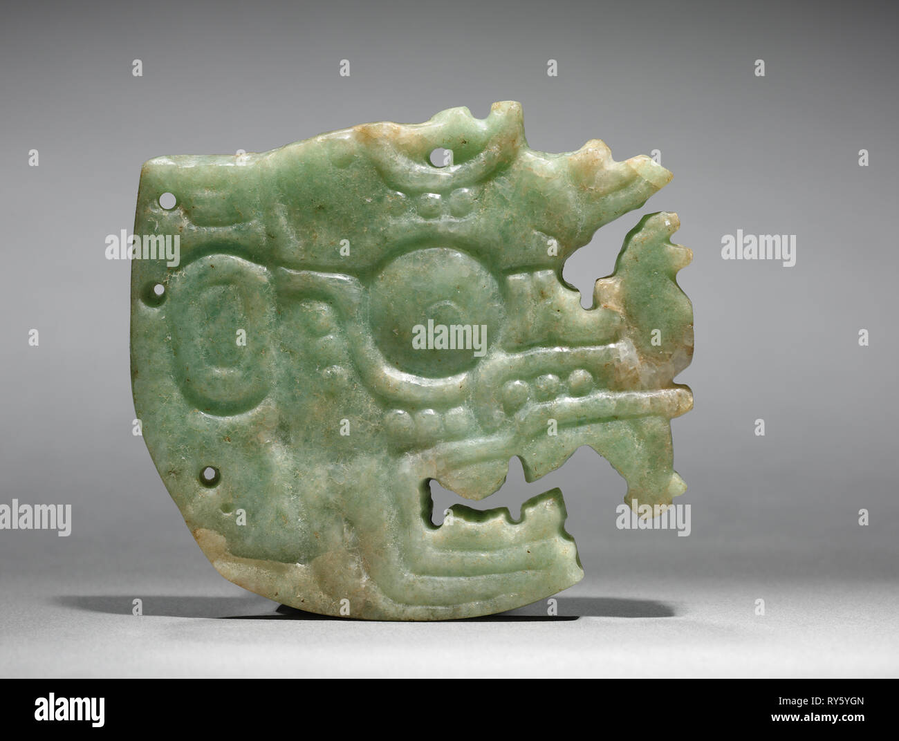 Ornament, Maya style (250-900). Mexico or Central America, Maya style  (250-900). Jadeite-albitite; overall: 6.7 x 0.7 x 7.5 cm (2 5/8 x 1/4 x 2  15/16 in Stock Photo - Alamy