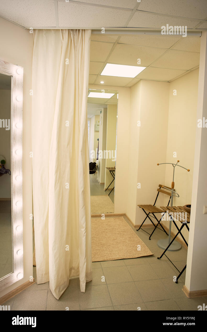 Fitting room in the store, in the showroom.Light curtain, lots of light. Stock Photo