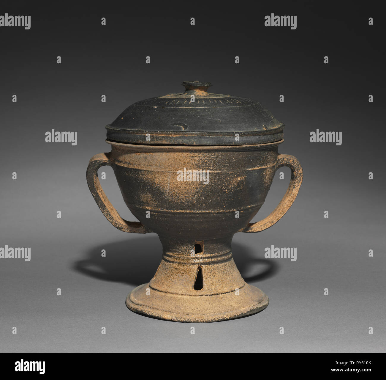 Lidded Cup with Strap Handles, 300s-400s. Korea, Kaya Period (42-562). Stoneware with natural ash glaze; overall: 21.1 cm (8 5/16 in.); outer diameter: 15.7 cm (6 3/16 in Stock Photo