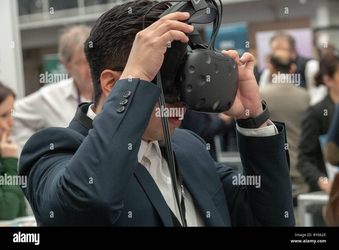 London, UK. 12th March 2019. A vistor tries out a VR Headset at The Wearable Technology Show at the Business Design Centre, The largest dedicated event for connected technology, the show features innovative products from start-ups as well as products from major technology companies and includes the latest in virtual reality and augmented reality devices and software Credit: Ian Davidson/Alamy Live News Stock Photo