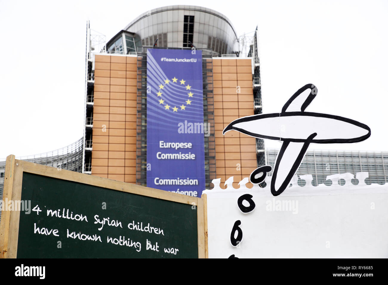 Brussels, Belgium. 12th March 2019. An enlarged real drawing by a Syrian girl, showing the scenes of violence and conflict which have been the backdrop to her childhood, to mark the start of the third Brussels conference on supporting Syria and the region, set up in front of the European institutions. Alexandros Michailidis/Alamy Live News Stock Photo