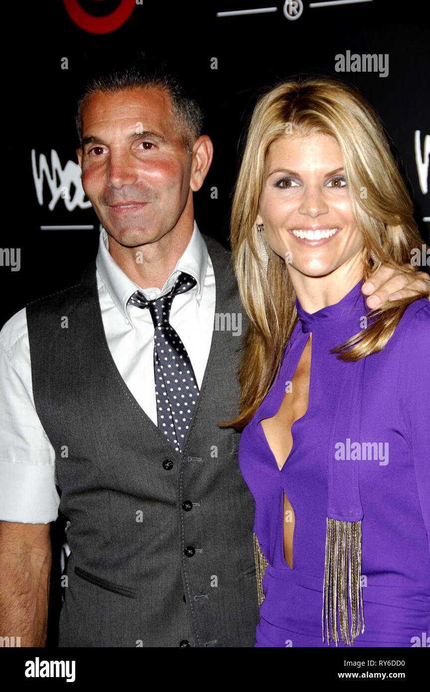 File Photo. 12th Mar, 2019. Lori Loughlin, The 'Full House' actress and fashion designer Mossimo Giannulli are among nearly 50 people charged in an admissions bribery scheme. PICTURED: Oct. 19, 2006 - Hollywood, California, U.S. - LORI LOUGHLIN AND Mossimo Giannulli at The Target Fashion Week Bash held at Area. Credit: Michael Germana/Globe Photos/ZUMAPRESS.com/Alamy Live News Stock Photo