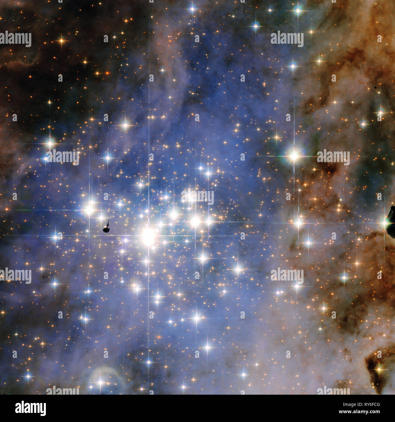 Trumpler 14, a huge star forming region located 8,000 light-years away in the Carina Nebula, contains one of the highest concentrations of massive, lu Stock Photo