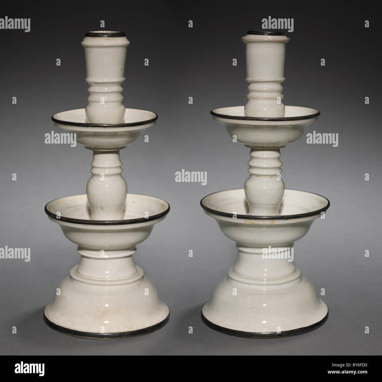 Candlesticks, 1600s. China, Ming dynasty (1368-1644). Glazed porcelain with metal rims; overall: 32.4 cm (12 3/4 in Stock Photo