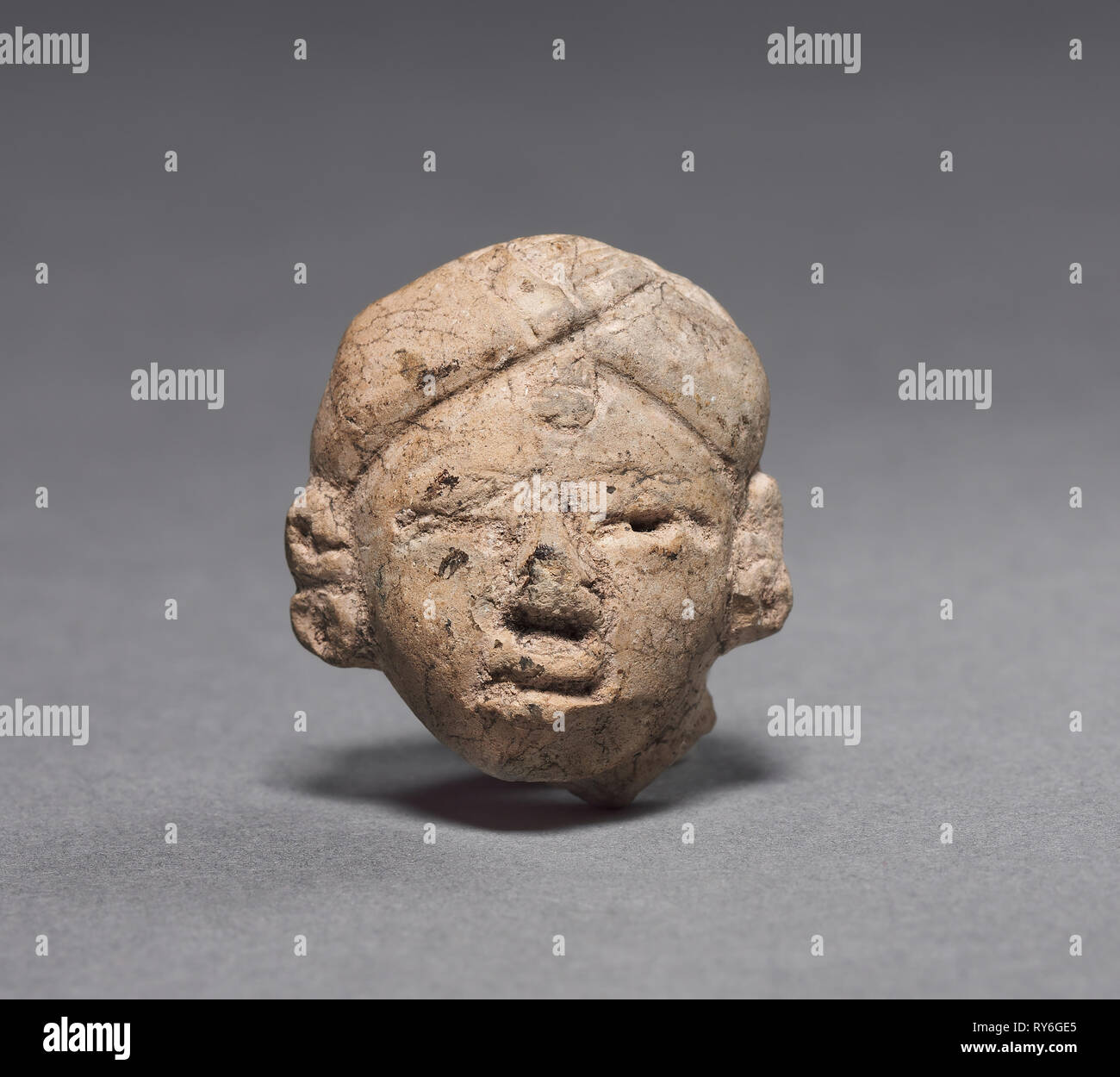 Figurine Head, c. 600-200 BC. Mexico or Central America, Maya(?), Middle Preclassic period. Pottery; overall: 3.1 x 2.6 x 1.9 cm (1 1/4 x 1 x 3/4 in Stock Photo