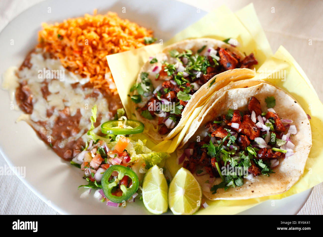 High angle view of tacos with meal served in plate on table Stock Photo