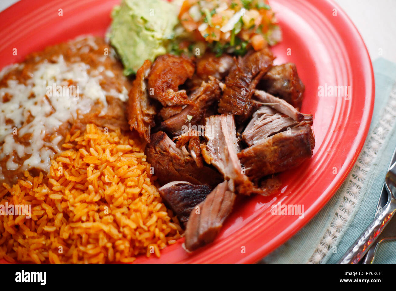 High angle view of rice with meat and salad served in plate on table Stock Photo