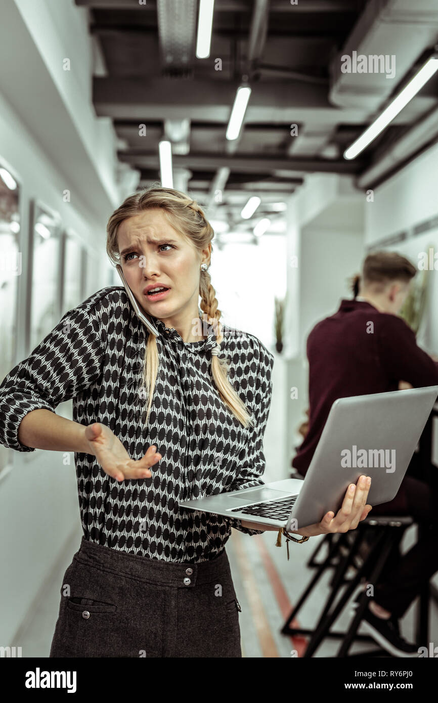 Light-haired expressive woman being extremely busy at work Stock Photo