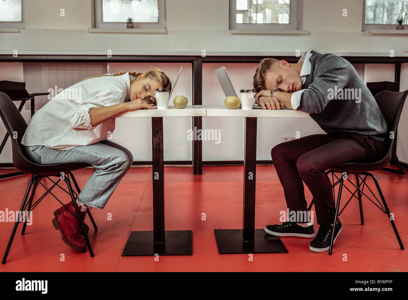 Office workers being extremely tired during active workday Stock Photo