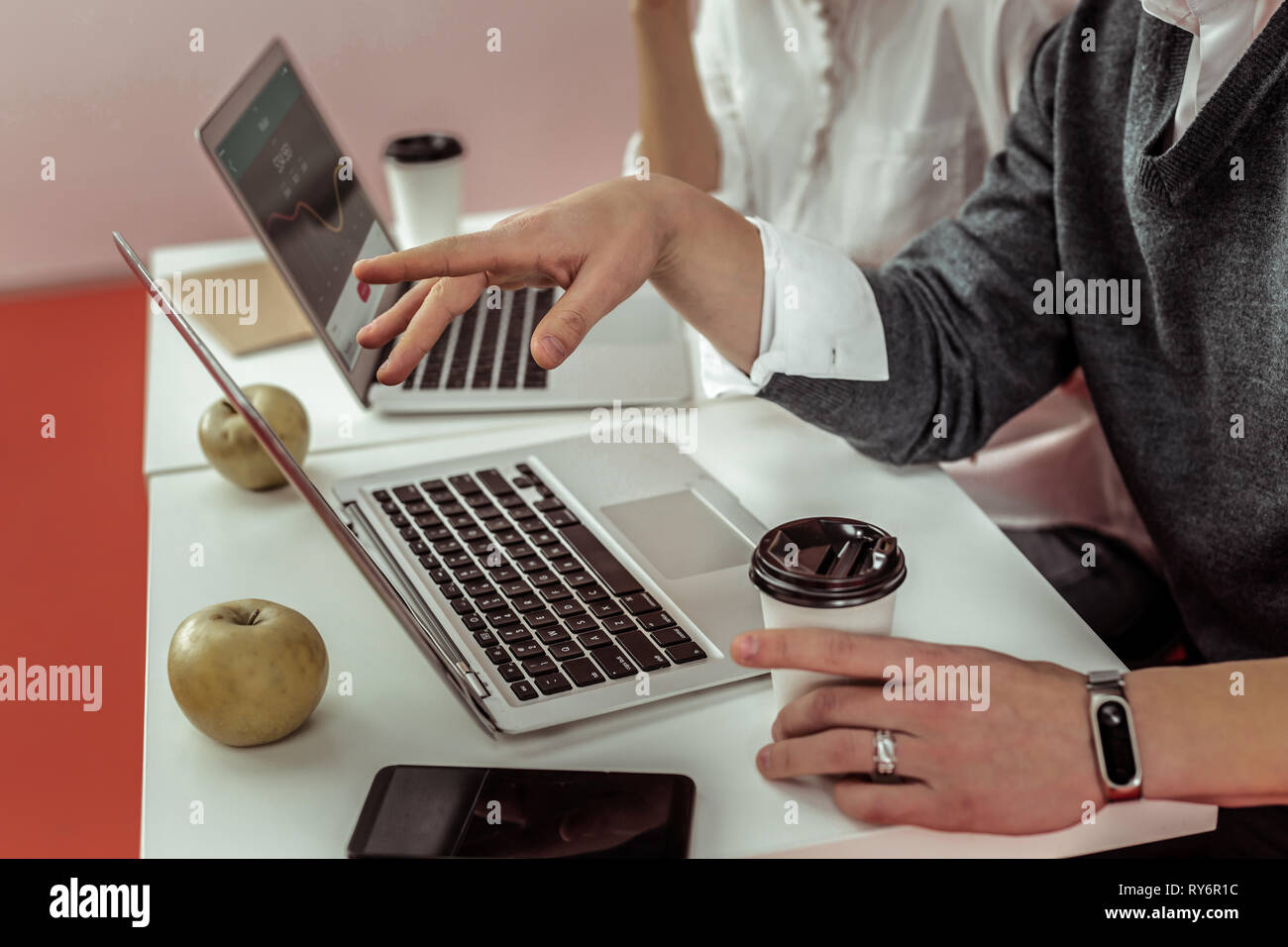 Resolute guy paying attention on information on laptop screen Stock Photo