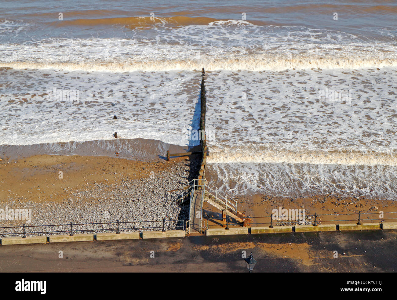 A moderate sea with breakwater on the North Norfolk coast in winter at Cromer, Norfolk, England, United Kingdom, Europe. Stock Photo
