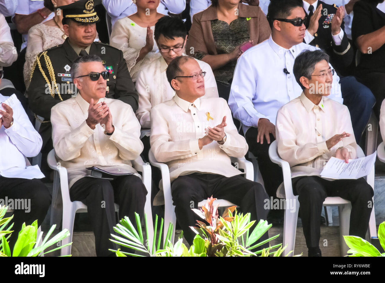U.S. Ambassador Philip Goldberg (left), 15th Filipino President Benigno Aquino III (center), and Japanese Ambassador Kazuhide Ishikawa clap during a s Stock Photo