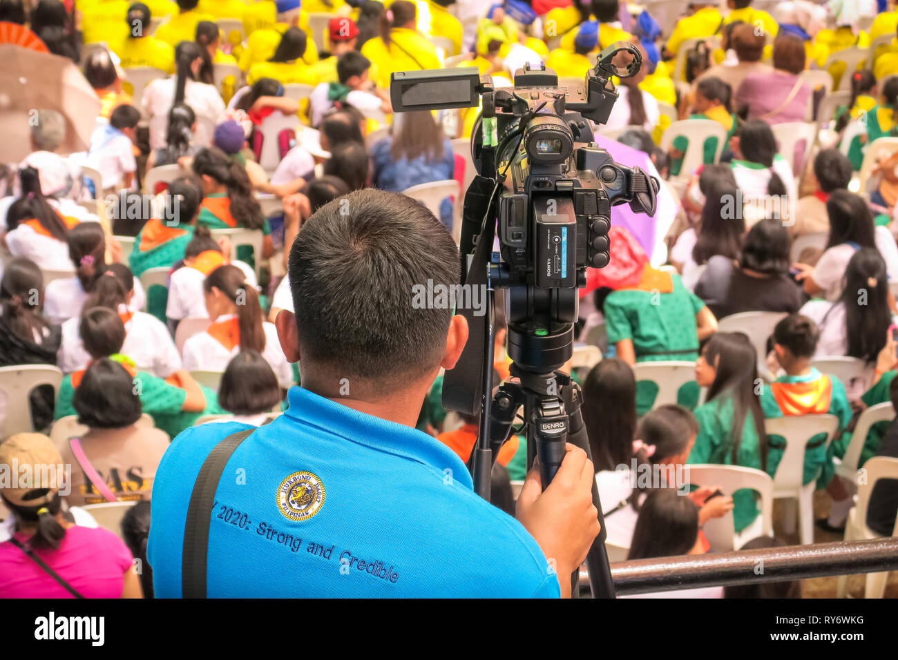 Camera man filming speeches over the audience at the 74th Bataan Day Anniversary - Mount Samat, Philippines Stock Photo