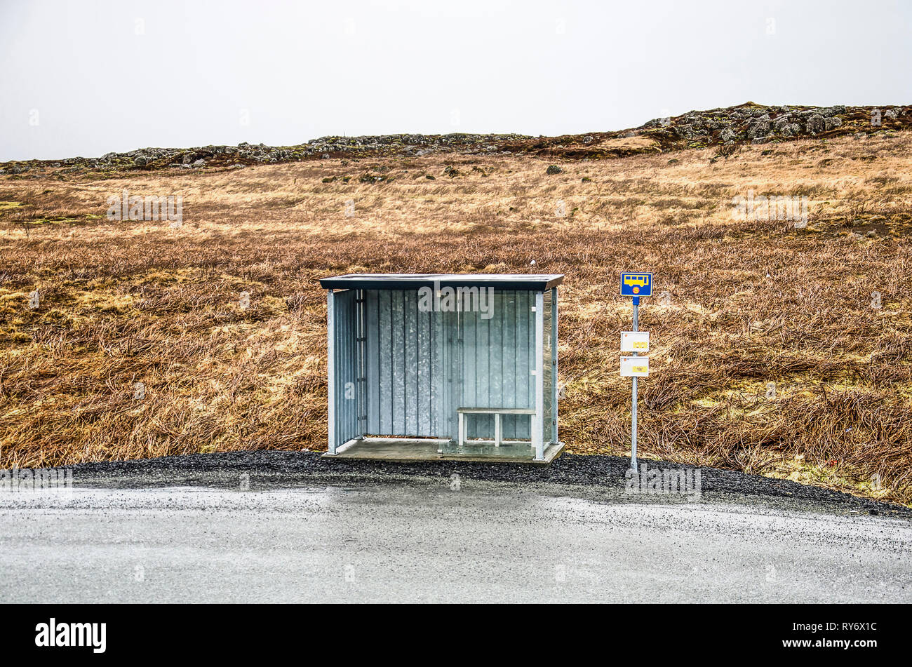 Reykjanes peninsula, March 1, 2019: little metal shelter at a busstop in a deserted landscape on a rainy day Stock Photo