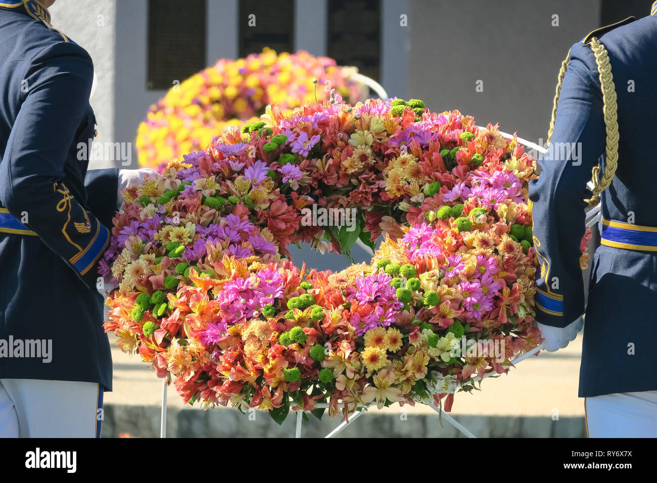 Colorful flower wreath carried by officers at Capas Shrine, Tarlac, Philippines Stock Photo