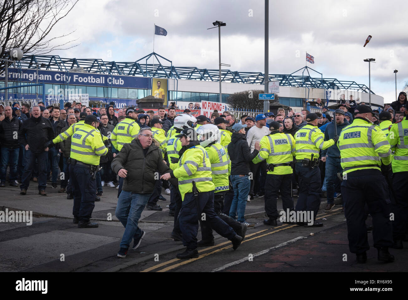 Bordesley, Birmingham, West Midlands, UK. 10th March 2019. Up to 150 home supporters taunted and threw bottles at arriving Aston Villa fans prior to t Stock Photo