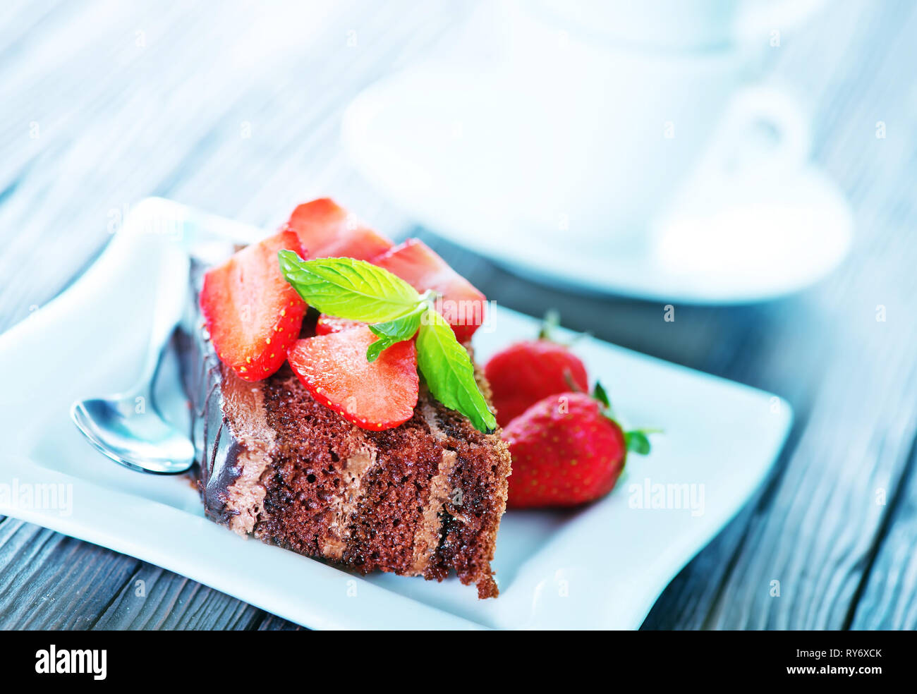 chocolate cake with strawberry on plate Stock Photo - Alamy