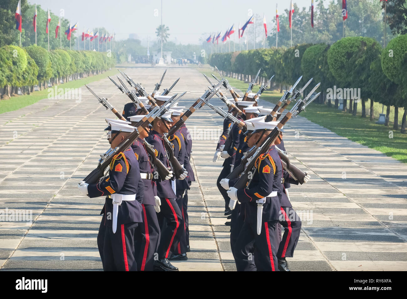 Color Guard Officers Doing Rifle Routine in Formation - 74th Bataan Day Anniversary - Capas Shrine, Tarlac, Philippines Stock Photo