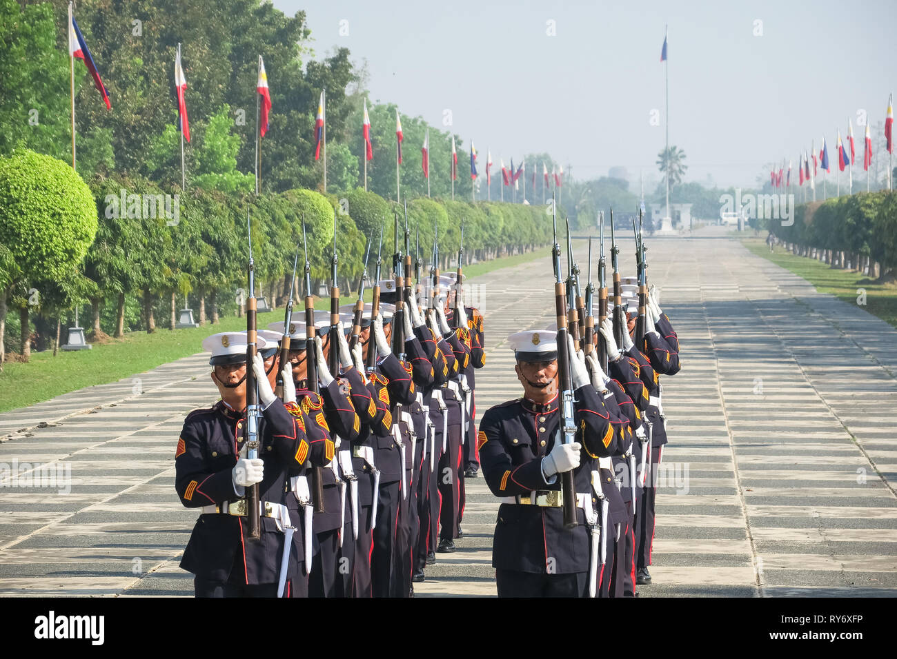 Color Guard Officers Doing Rifle Routine in Formation - 74th Bataan Day Anniversary - Capas Shrine, Tarlac, Philippines Stock Photo