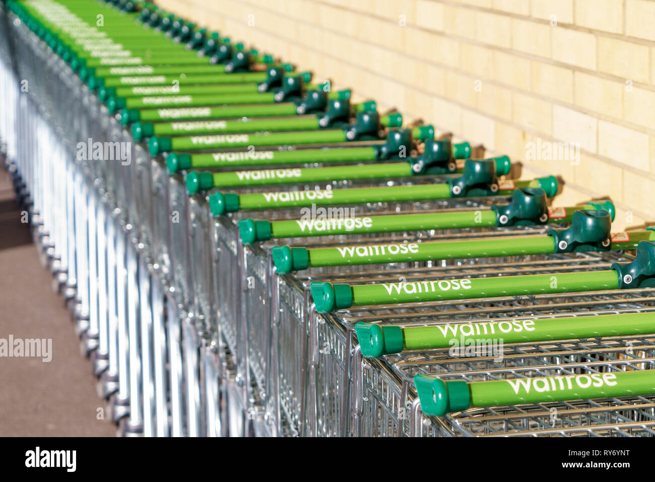 Line of Waitrose supermarket shopping trolleys Stock Photo