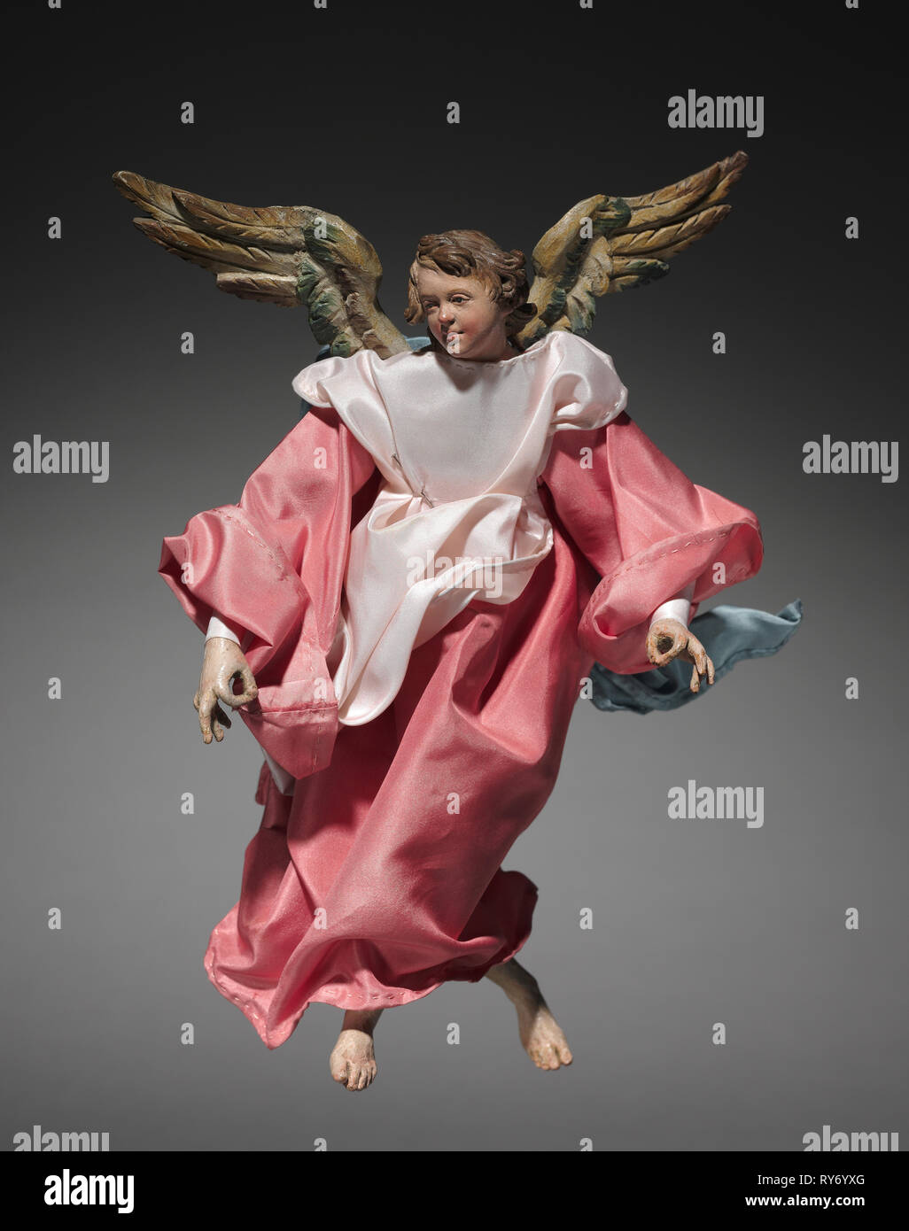 Figure from a Crèche: Angel, 1780-1830. Italy, Naples, late 18th-early 19th century. Painted wood and terracotta with various textiles; overall: 22.2 cm (8 3/4 in Stock Photo