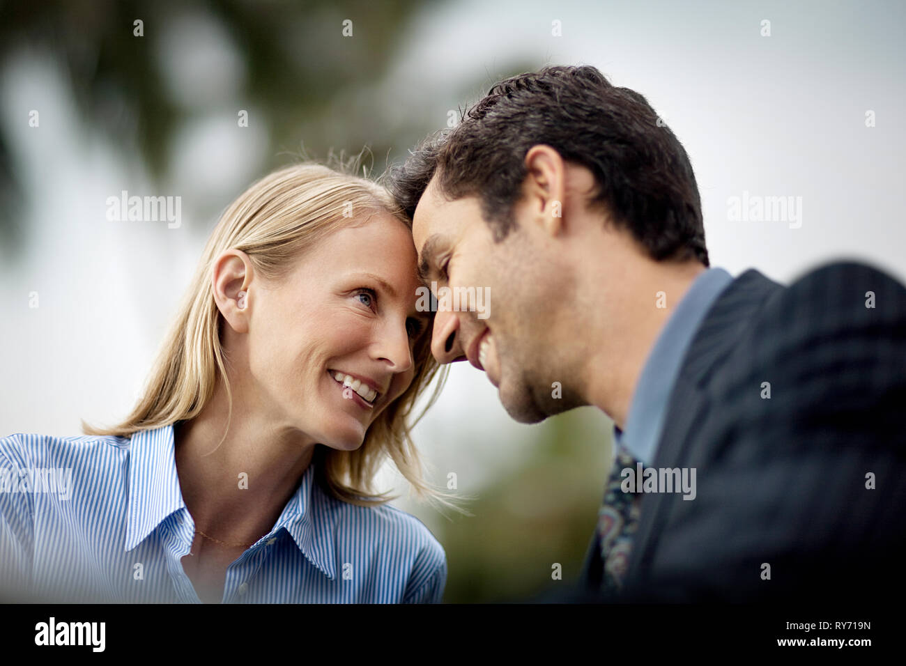 Portrait of midadult corporate couple sharing