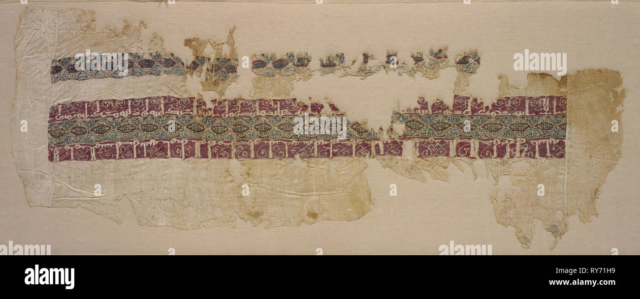 Sleeve with tiraz, 1045 - 1058. Egypt, Fatimid period, reign of Caliph al-Mustansir, 1045-58. Plain weave with inwoven tapestry weave: linen and silk; overall: 20.3 x 51.8 cm (8 x 20 3/8 in Stock Photo