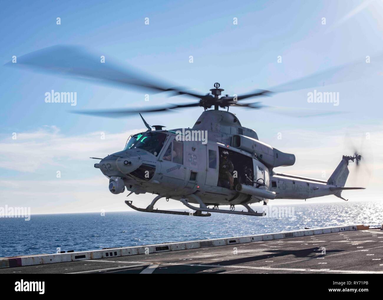 190308-N-HG389-0169 MEDITERRANEAN SEA (Mar. 8, 2019) A UH-1Y Huey helicopter assigned to the “Black Knights” of Marine Medium Tiltrotor Squadron (VMM) 264 (Reinforced) departs the flight deck of the San Antonio-class amphibious transport dock ship USS Arlington (LPD 24), Mar. 8, 2019. Arlington is on a scheduled deployment as part of the Kearsarge Amphibious Ready Group in support of maritime security operations, crisis response and theater security cooperation, while also providing a forward naval presence. (U.S. Navy photo by Mass Communication Specialist 2nd Class Brandon Parker/Released) Stock Photo