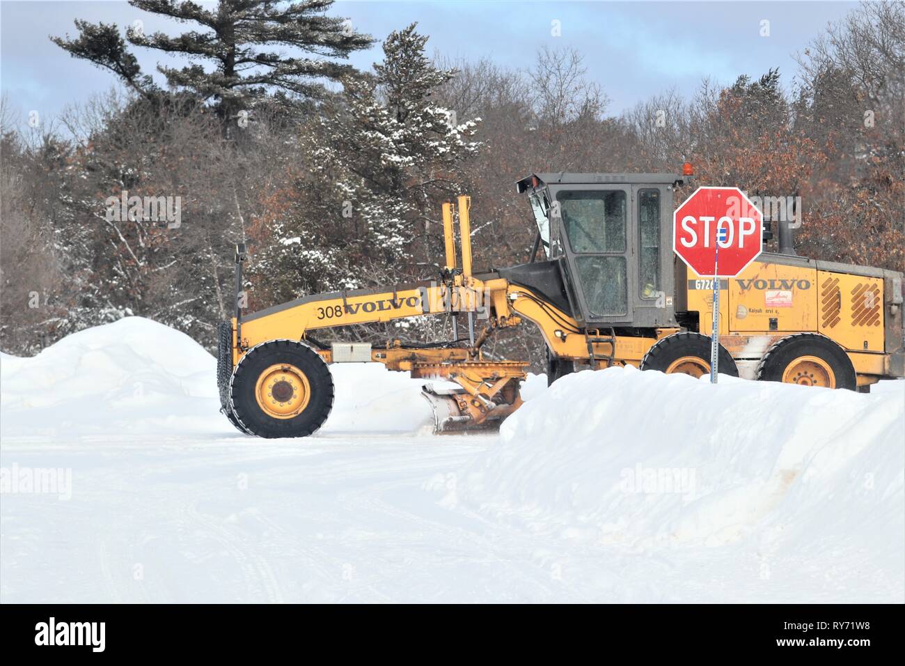 An equipment operator with the Fort McCoy snow removal contractor, Kaiyuh Services LLC of Anchorage, Alaska, clears snow Feb. 27, 2019, at Fort McCoy, Wis. Winter in Wisconsin can provide all kinds of bad weather, including freezing rain, snow, or sleet at any time or even all in one day. When that happens, the Fort McCoy snow-removal team plows through whatever Mother Nature dishes out. The team includes as well as Directorate of Public Works personnel. The team helps keep more than 400 miles of roads, sidewalks, and parking areas clear so the Fort McCoy workforce can operate safely. (U.S. Ar Stock Photo