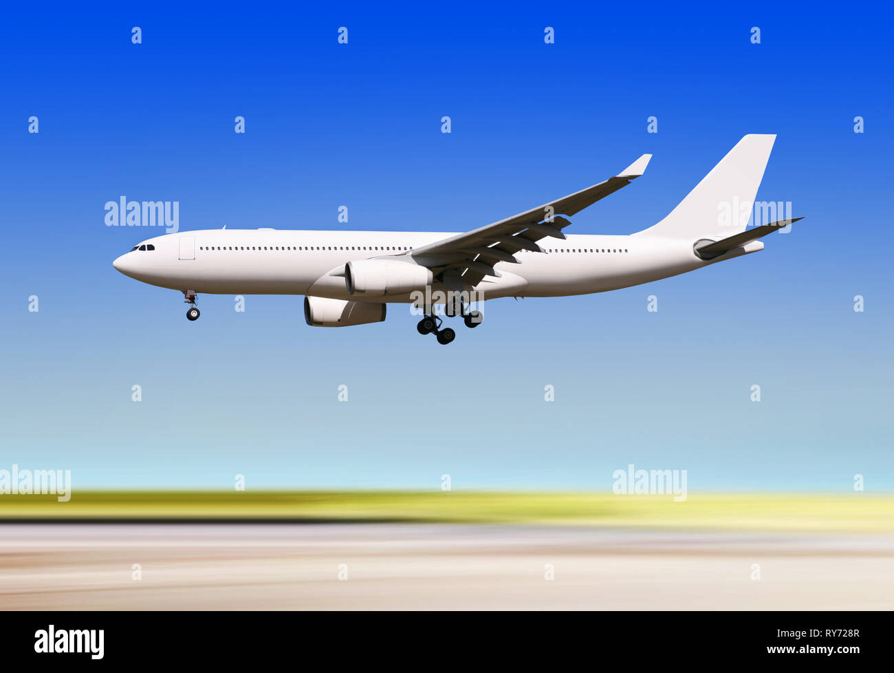 big passenger airplane is landing to runway of airport Stock Photo