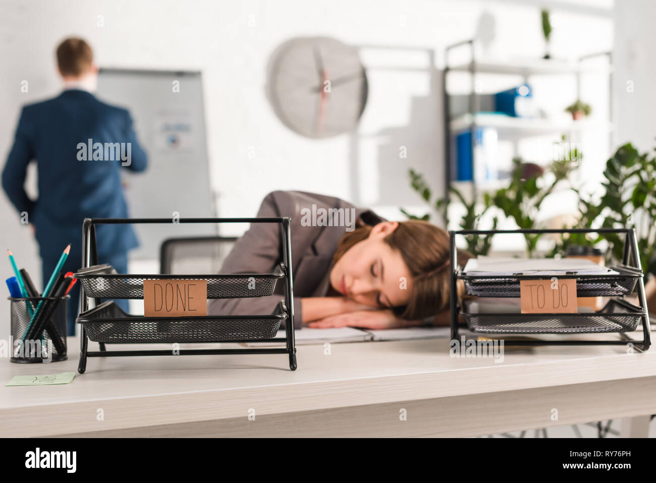 Selective Focus Of Document Trays With Lettering Near Woman