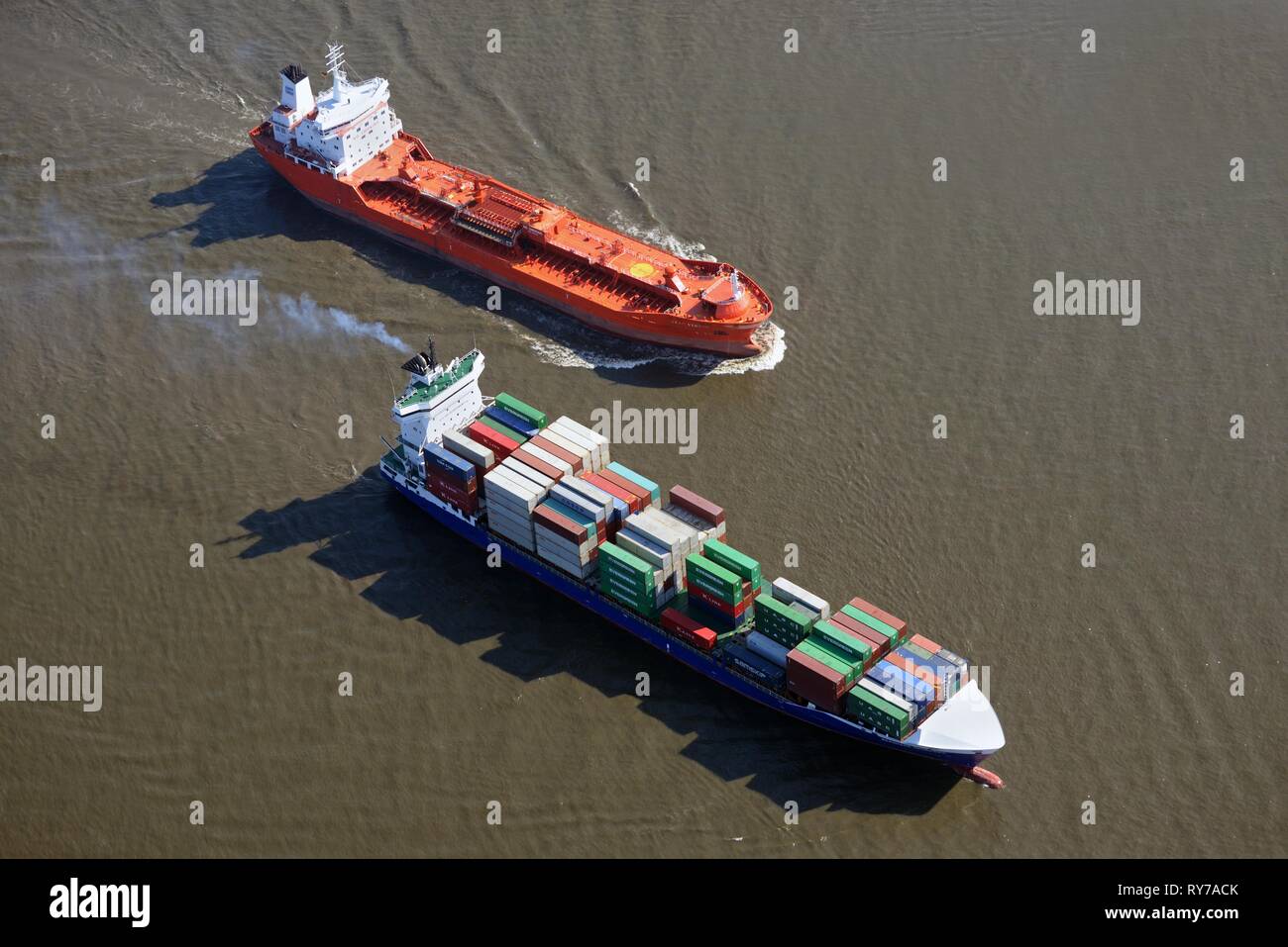 Feeder ship and tanker on the Elbe, Hamburg, Germany Stock Photo