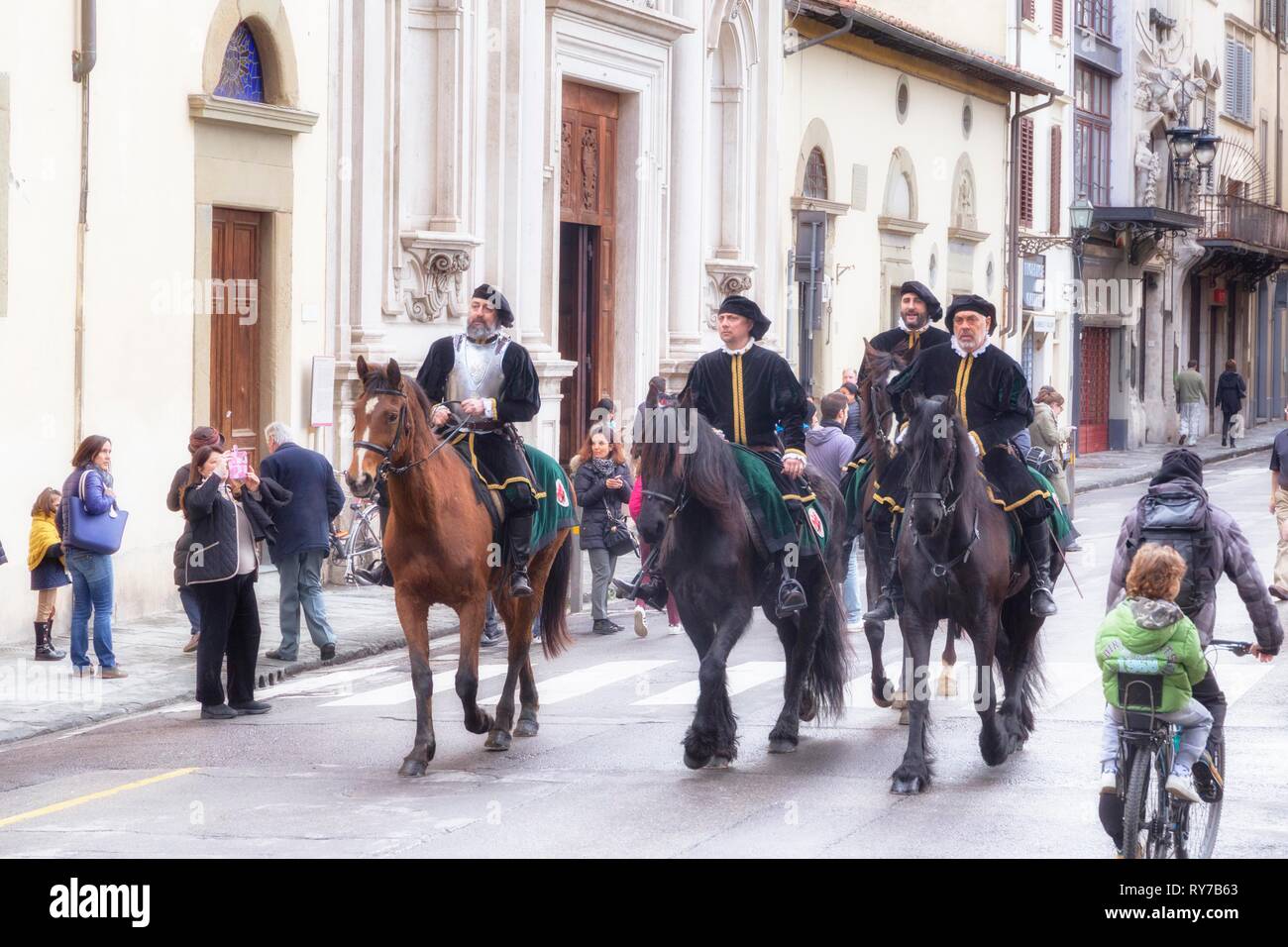 Participants in historical clothing riding on horses, Scoppio del Carro or Explosion of the Cart festival, Florence, Tuscany Stock Photo