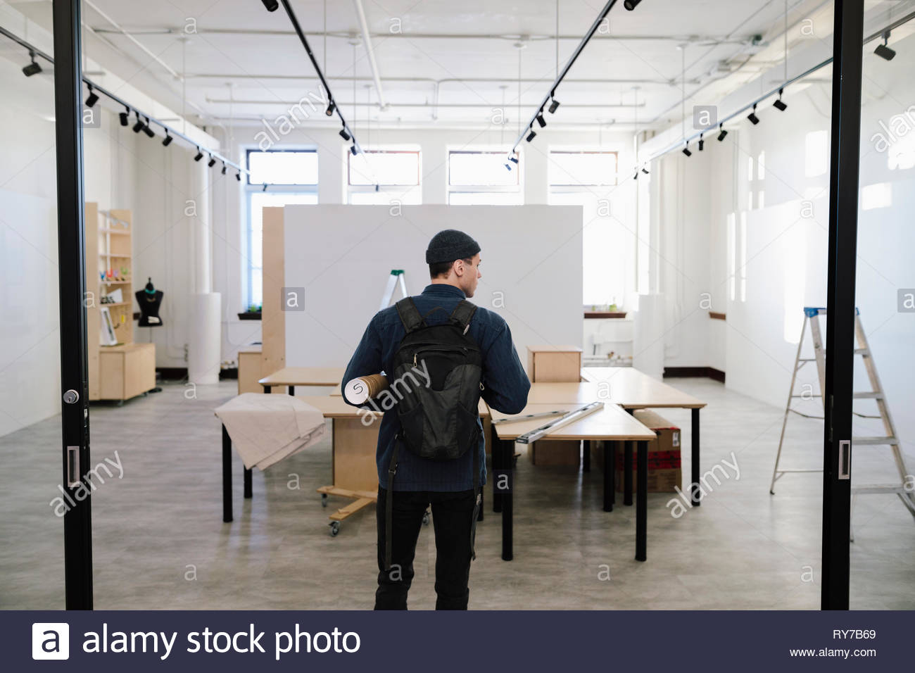 Male artist entering art gallery Stock Photo