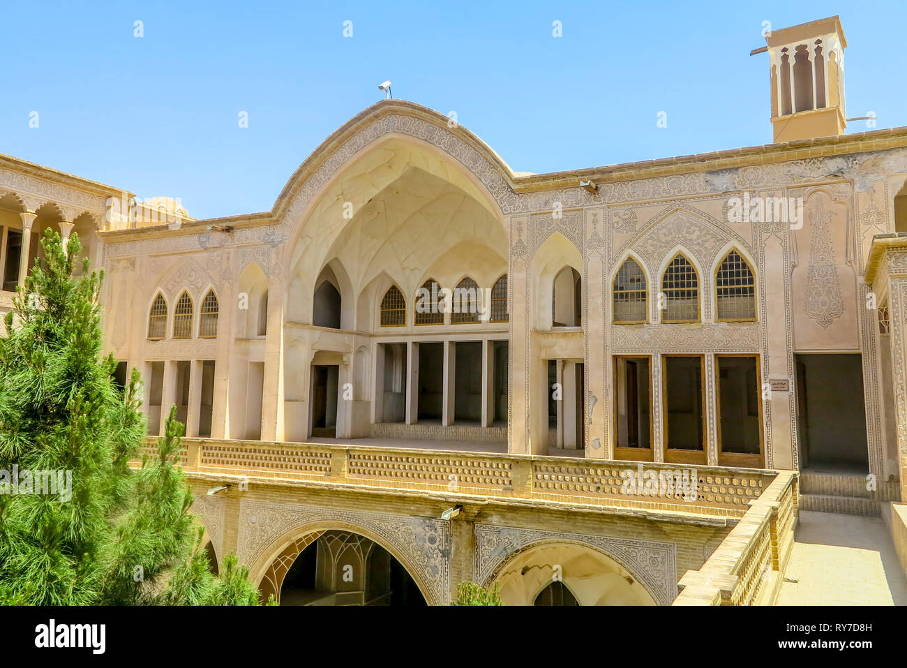 Kashan Boroujerd Historical House Courtyard Portal with Windcatcher Tower Stock Photo