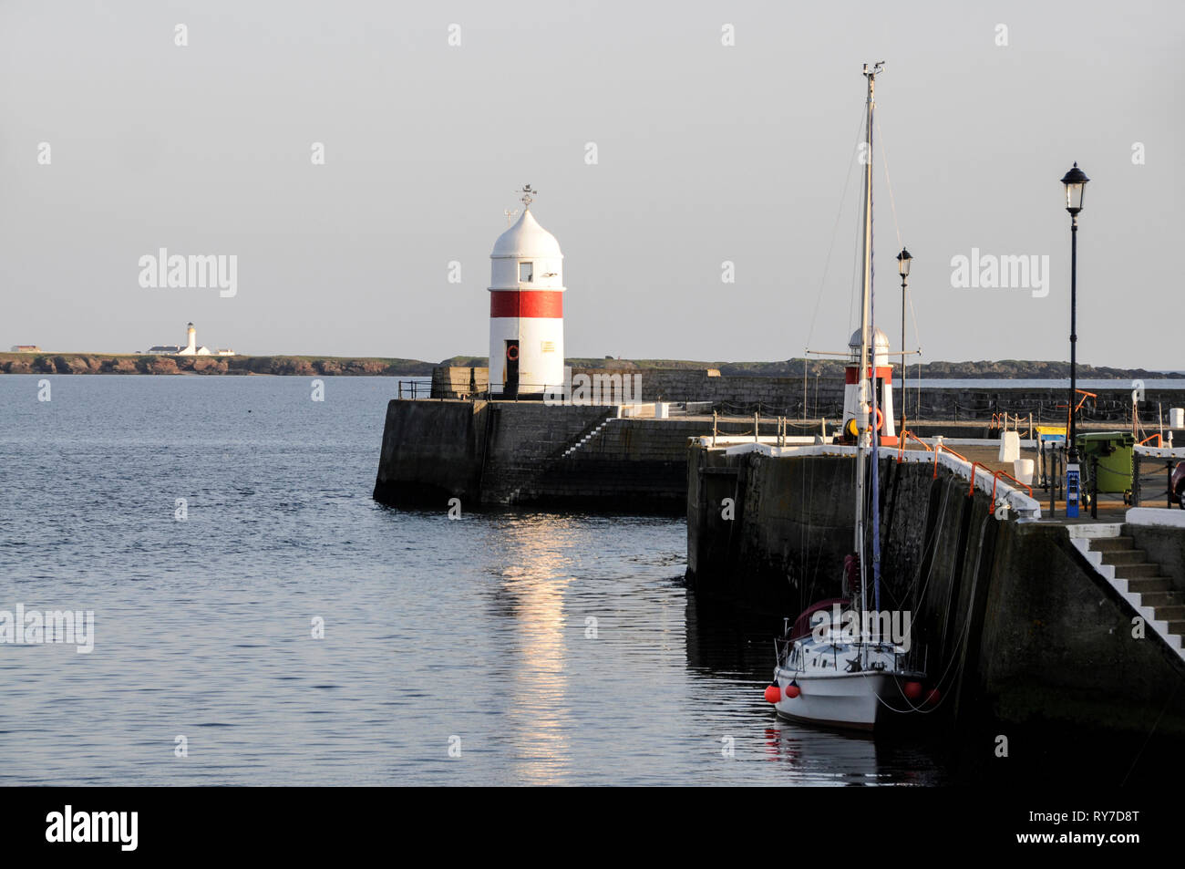 Harbour lights lighthouse at the entrance to the harbour in Castletown