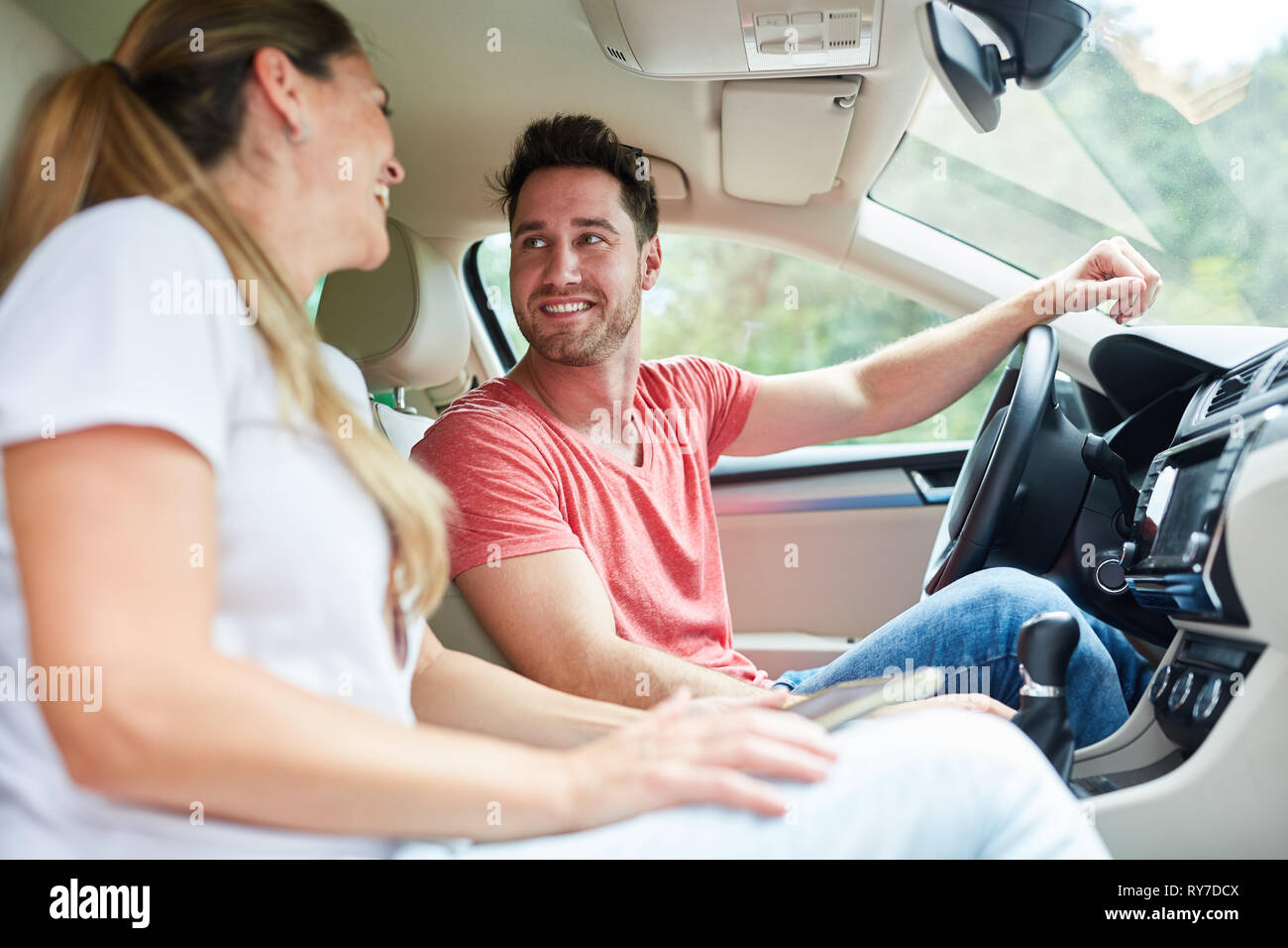 Young couple in the car on vacation or on a trip Stock Photo