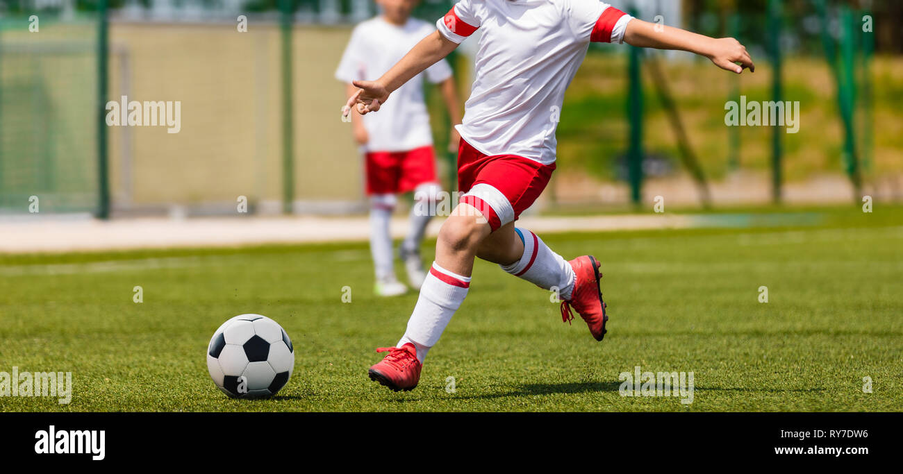 Soccer Shot. Young Boys Kicking Football Soccer Tournament Match on the