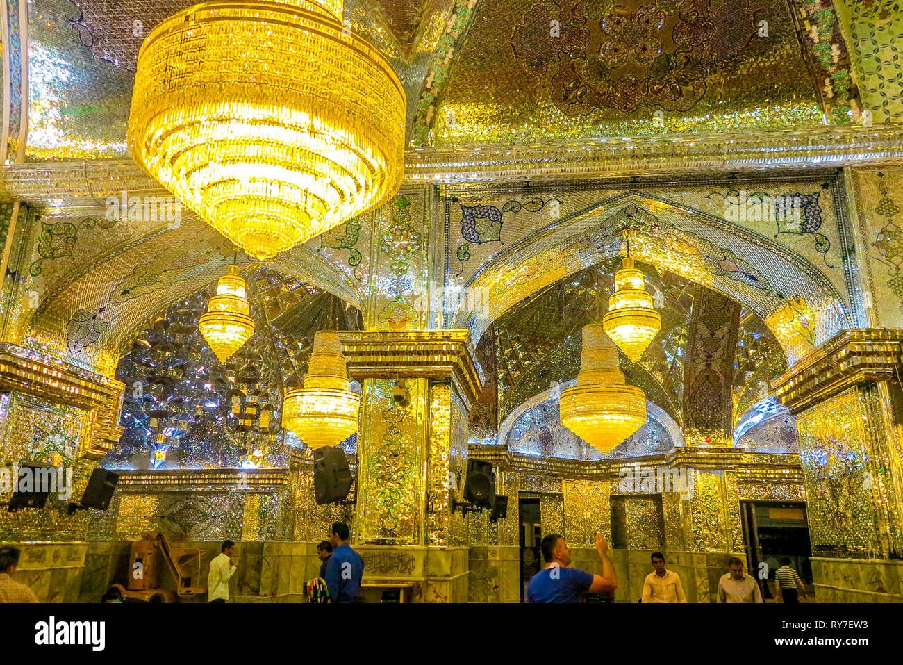Shiraz Sayyed Alaeddin Hossein Mosque with Pilgrims Praying People Mirror Mosaics and Chandeliers Stock Photo