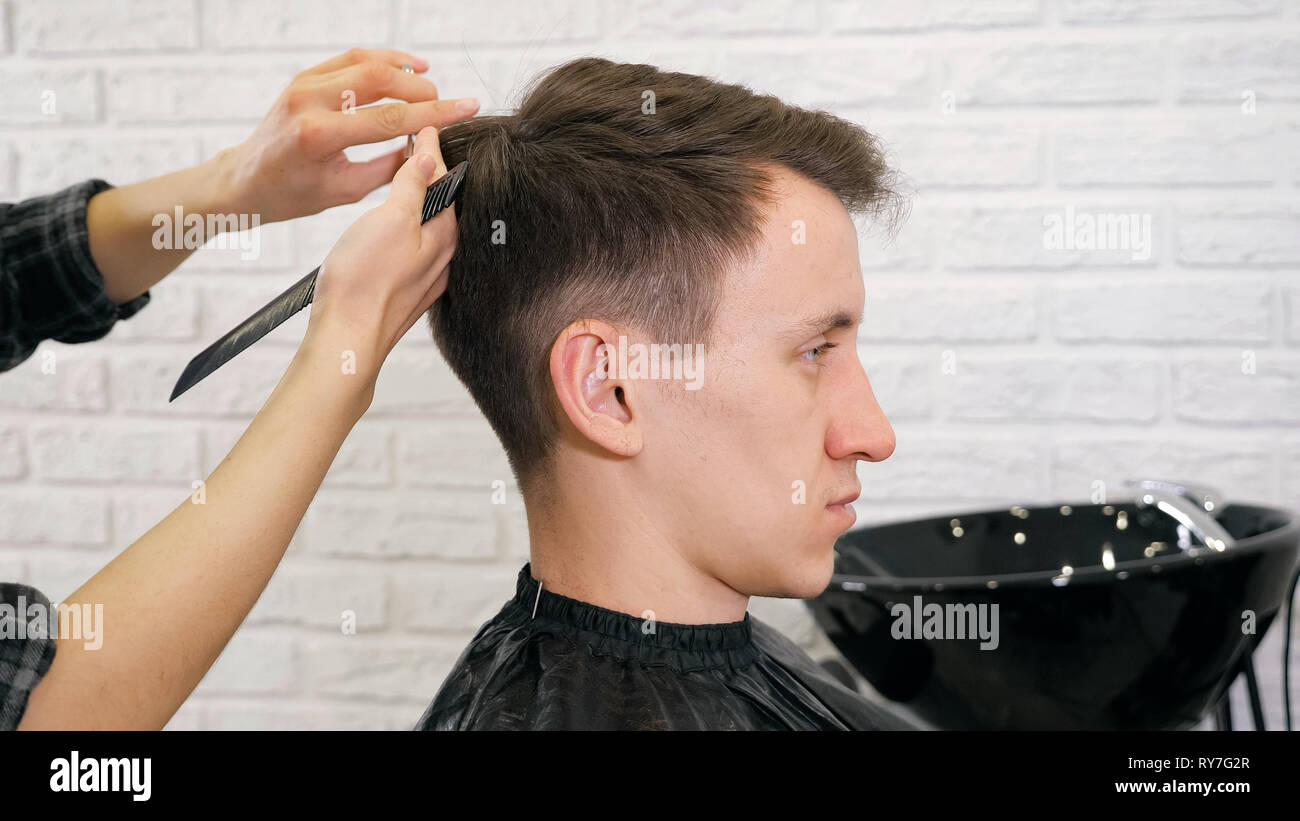 Female hairdresser haircut doing male hair style Stock Photo - Alamy