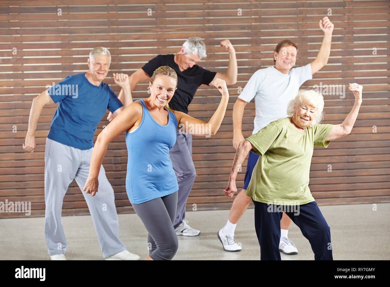 Group of seniors dancing together Bokwa in the fitness center Stock Photo